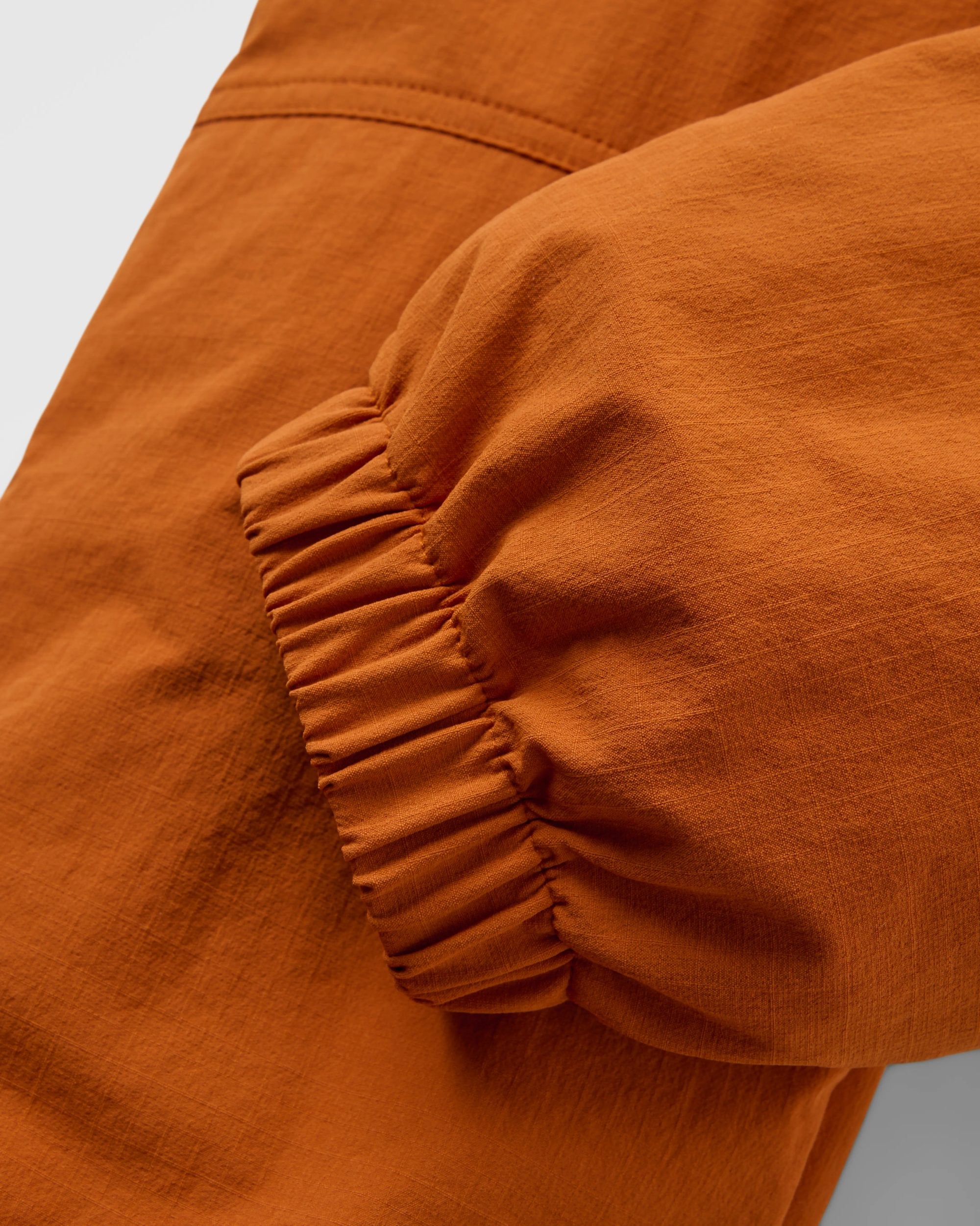 Sandstone Recycled Active Trail Jogger - Sunset Orange - Flatlay