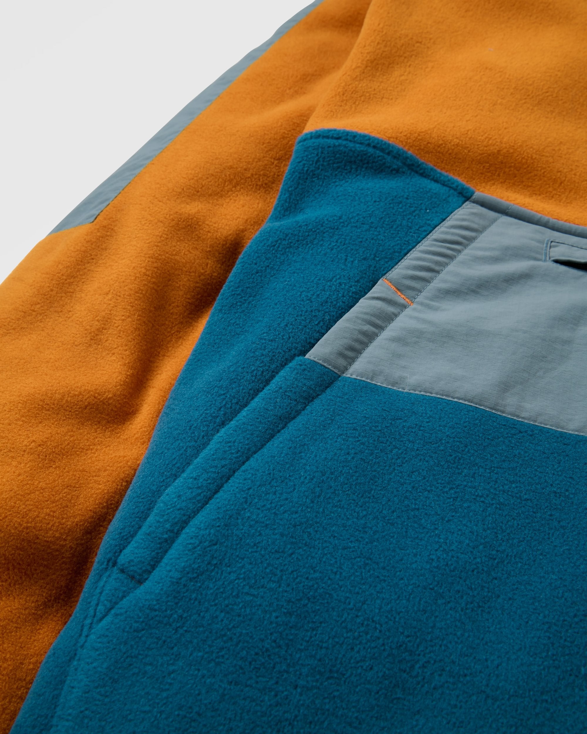 Woodland Hooded Recycled Polartec® Fleece - Retro Orange/Tidal Blue - Flatlay